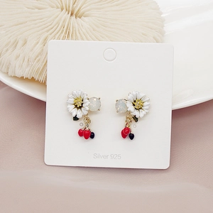 Detail of floral asymmetrical earrings with cherry pendants on S925 silver needles