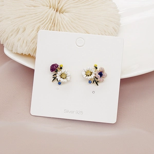 Detail of floral enamel earrings with S925 silver needles and colorful flower petals