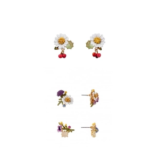 Three pairs of enamel floral earrings with daisy, cherry, and gemstone charms