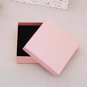 Pink square cardboard jewelry gift box with black velvet lining for earrings or rings