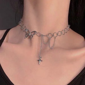 Detailed close-up of a silver butterfly choker with star pendant and tassel chains