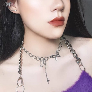 Silver multi-layer choker necklace with butterfly pendant and long star tassels