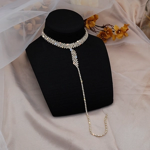 Elegant silver tassel Y-necklace with shimmering rhinestones on black velvet neck display