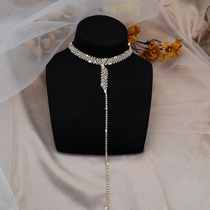 Detailed view of silver choker necklace with rhinestones and elegant long tassel pendant