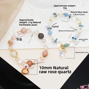 Detail of beaded bracelets with rose quartz, aquamarine, pearls and golden charms