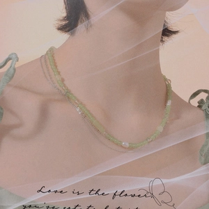 Double-layered necklace with green crystal beads and pearls on silver chain for women