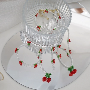 Parure collier et bracelet avec perles cerises et fermoir doré en métal