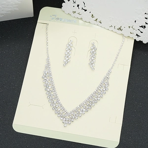 Elegant silver rhinestone V-shaped necklace and drop earring set for evening dresses
