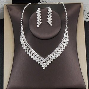 Exquisite silver necklace and earrings set with shimmering crystals for formal events