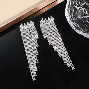 Detailed view of silver cascading rhinestone tassel earrings with teardrop crystal studs