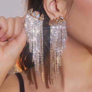 Sparkling tassel earrings with white rhinestones and yellow pear-cut gemstone accents
