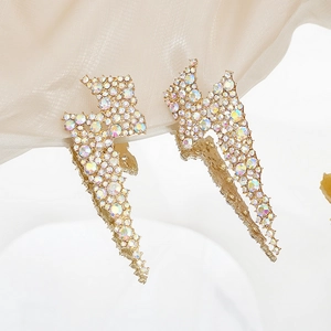Dramatic gold lightning bolt earrings with AB rainbow crystals for evening parties