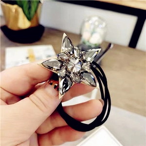 Star rhinestone hair tie with crystal accents on a high-elastic black rubber band