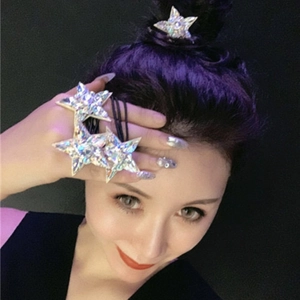 Close-up of sparkling crystal star hair ties with silver base on black elastic band