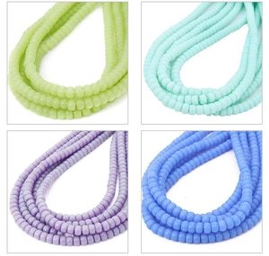Macro detail of 6-8mm smooth glass cylinder beads in assorted pastel colors for DIY jewelry