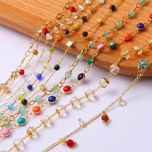 Close-up of colorful beads and 18k gold plated chains for DIY jewelry making