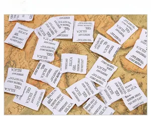 Detailed view of white silica gel desiccant packets for jewelry moisture protection