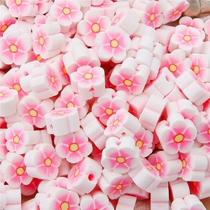 Bulk pack of pink gradient polymer clay flower beads for DIY jewelry and handmade necklaces