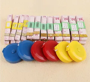 Close-up of soft tape measures and colorful automatic retractable round measuring tapes
