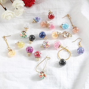 DIY glass ball pendants with colorful star sequins and golden hooks for earrings