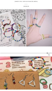 Detail showing 2mm cream glass seed beads handcrafted into letter rings and bracelets