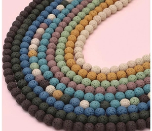 Macro shot of colorful porous lava stone beads for DIY jewelry making and bracelets