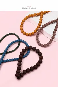 Macro shot of colorful lava stone beads with natural volcanic textures and porous finish