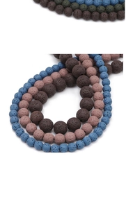 Macro detail of colorful porous lava stone beads for DIY jewelry making and bracelets