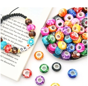 DIY colorful acrylic beads with large holes shown on open book background