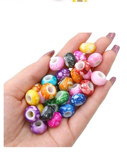 Macro shot of colorful acrylic marble beads with large holes for DIY jewelry making