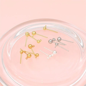 Macro view of gold and silver plated stud earring findings for DIY jewelry making
