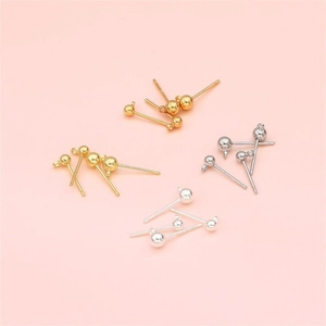Close-up of DIY 925 silver round ball stud earrings in gold, silver and white gold finishes