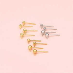 Detail of gold and silver 925 silver plated ball stud earrings with loops for DIY jewelry