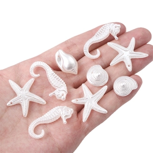Pearlescent white acrylic seahorse and starfish beads for ocean themed DIY jewelry