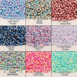 Macro shot of 4-10mm iridescent ABS loose faux pearls in nine color mix for DIY crafts