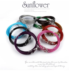 Detailed close-up of multi-color DIY memory steel wire jewelry cords with screw clasps