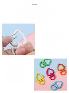Close-up of colorful heart-shaped spring buckles in painted alloy for DIY keychains