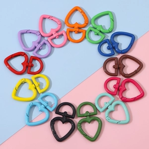 Colorful heart-shaped spring ring clasps in twelve vibrant hues arranged in a circle
