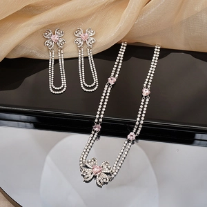 Elegant pink heart bow jewelry set with tassel earrings and layered rhinestone necklace