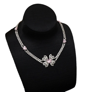 Elegant double-layered bow necklace with pink heart crystals and sparkling rhinestones