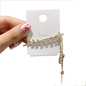 Barrette à cheveux feuille dorée élégante avec strass zircon et pompon en perles