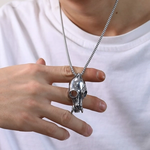 Men's punk stainless steel animal skull pendant necklace on box chain worn by model