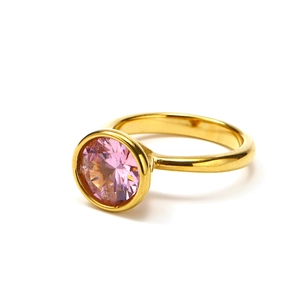Detail view of 18k gold plated ring featuring a large round pink zircon in bezel setting