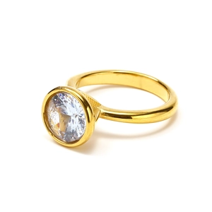 Detailed macro view of 18k gold plated ring with round cut cubic zirconia bezel setting