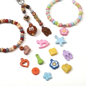 DIY macaron acrylic beads set with colorful star, heart, and flower charms for bracelets