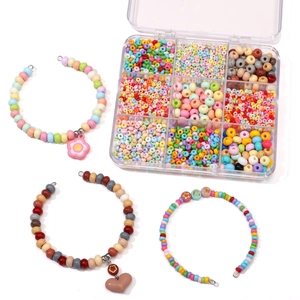 DIY jewelry kit with colorful glass seed beads and macaron beads in a clear plastic box