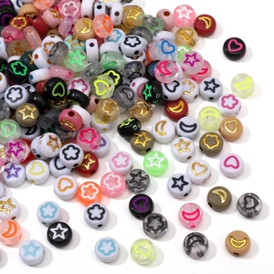 Detailed macro view of 7x4mm acrylic beads with star, moon, and heart shapes for DIY jewelry