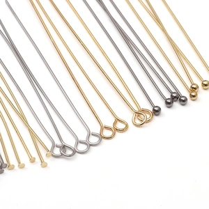 Detailed collection of assorted stainless steel DIY jewelry pins in gold, silver, and black
