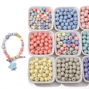 DIY 8-10mm macaron acrylic round beads organized in white bowls for jewelry making