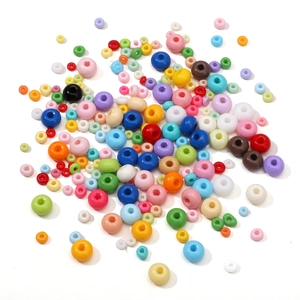 Macro shot of colorful 3-6mm round glass seed beads for DIY jewelry and necklaces